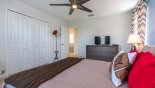 Bedroom 3 with large walk in wardrobe, hat stand & ceiling fan from Alexander Palm 1 Villa for rent in Orlando