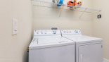 Laundry room with full sized washer and tumble dryer from Solterra Resort rental Villa direct from owner