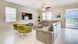 Villa rentals near Disney direct with owner, check out the Family room with wrap around sofa seating & large wall mounted 55