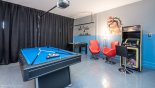 Games room complete with 2 gaming chairs, arcade game & pool table from Maui 8 Villa for rent in Orlando