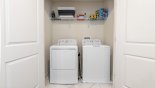 Spacious rental Champions Gate Villa in Orlando complete with stunning Laundry room with full sized washer & tumble dryer & iron & ironing board