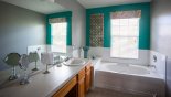 Villa rentals in Orlando, check out the Master 1 ensuite bathroom with Roman bath, his & hers sinks, large walk-in shower & separate WC