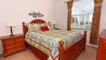 Bedroom 2 with queen sized bed and views over pool deck from Highlands Reserve rental Villa direct from owner