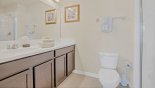 Master #1 ensuite bathroom with walk-in double shower, dual vanities & WC with this Orlando Villa for rent direct from owner