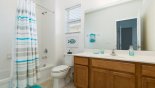 Ensuite bathroom #4 with bath & shower over - www.iwantavilla.com is the best in Orlando vacation Villa rentals