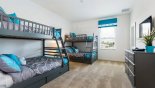 Spacious rental Providence Villa in Orlando complete with stunning Bedroom #4 with 2 bunk beds (twin over full-size) & wall mounted LCD cable TV