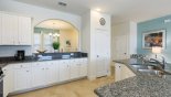 View of kitchen towards entrance hallway with this Orlando Villa for rent direct from owner