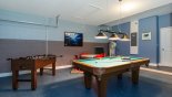 Games room with pool table, air hockey,  table foosball & wall mounted LCD cable TV - www.iwantavilla.com is the best in Orlando vacation Villa rentals