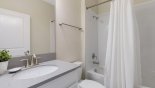 Family bathroom #3 with bath & shower over from Champions Gate rental Villa direct from owner