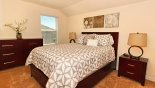 Upstairs bedroom 5 with queen sized bed - www.iwantavilla.com is the best in Orlando vacation Villa rentals
