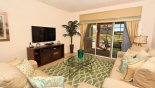 Orlando Villa for rent direct from owner, check out the Family room with wall mounted LCD cable TV & DVD - views & access onto pool deck