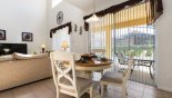 Villa rentals in Orlando, check out the Breakfast nook with round table & 4 chairs - views & access onto pool deck