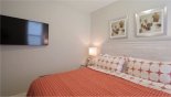 Master bedroom #2 with wall mounted LCD cable TV from Castillo 1 Villa for rent in Orlando