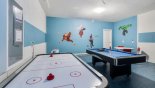 Games room with pool table, air hockey & table foosball - www.iwantavilla.com is your first choice of Villa rentals in Orlando direct with owner