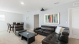Entertainment loft with comfortable sectional leather sofa set & armchair with this Orlando Villa for rent direct from owner