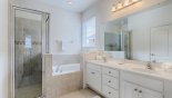 Master 1 ensuite bathroom with Roman bath, walk-in shower, his & hers sinks & separate WC from Solterra Resort rental Villa direct from owner