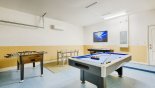 Spacious rental Solterra Resort Villa in Orlando complete with stunning Games room with pool table, air hockey, table foosball & wall-mounted LCD cable TV