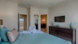 Master bedroom with wall mounted LCD cable TV from Adalia 2 Townhouse for rent in Orlando