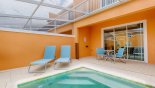 View of pool deck with 2 sun loungers with this Orlando Townhouse for rent direct from owner