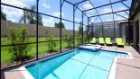 Pool deck with 4 sun loungers - www.iwantavilla.com is the best in Orlando vacation Villa rentals
