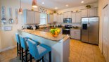 Fully equipped kitchen with breakfast bar & 3 bar stools - www.iwantavilla.com is the best in Orlando vacation Villa rentals