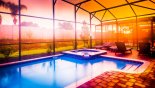 South facing pool at sunset (colour enhanced photo) from Champions Gate rental Villa direct from owner