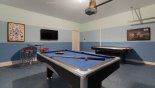Games room with pool table, air hockey & wall mounted LCD cable TV from Belize 2 Villa for rent in Orlando