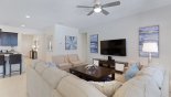 Family room with large wall mounted LCD cable TV from Solterra Resort rental Villa direct from owner