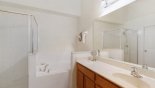 Master ensuite bathroom with bath, walk-in shower & separate WC with this Orlando Villa for rent direct from owner