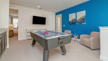 Spacious rental Reunion Resort Villa in Orlando complete with stunning Upstairs gaming loft with air hockey table  & wall mounted LCD cable TV