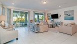 Great room with views and access onto pool deck - www.iwantavilla.com is the best in Orlando vacation Villa rentals