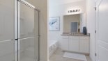 Master #1 ensuite bathroom with Roman bath, walk-in shower, vanity sink & separate WC with vanity sink from Atlantic 2 Villa for rent in Orlando
