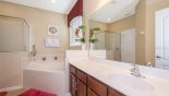 Spacious rental Solterra Resort Villa in Orlando complete with stunning Master #1 ensuite bathroom with Roman bath, walk-in shower, sink & separate WC