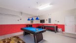 Games room with pool table, air hockey & wall mounted LCD cable TV with this Orlando Villa for rent direct from owner