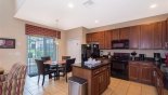 View of kitchen and breakfast nook with seating for 4 with this Orlando Villa for rent direct from owner