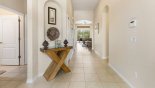 Villa rentals near Disney direct with owner, check out the Welcoming entrance hallway towards family room & pool deck beyond