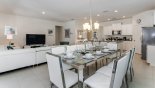 Dining area viewed towards kitchen & family room with this Orlando Villa for rent direct from owner