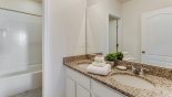 Family bathroom #4 with bath & shower over - www.iwantavilla.com is the best in Orlando vacation Villa rentals