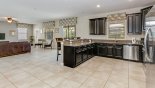 Kitchen & family room with views onto pool deck from Fiji 9 Villa for rent in Orlando