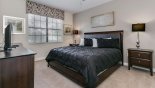 Ground floor master bedroom #2 with king sized bed & views onto front gardens from Fiji 9 Villa for rent in Orlando