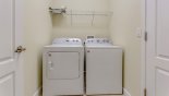 Laundry room with washer, dryer, iron & ironing board from Champions Gate rental Villa direct from owner