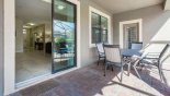 Patio doors from family room lead out onto the pool deck with this Orlando Villa for rent direct from owner