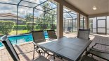 Patio table with 6 chairs under covered lanai from Fiji 9 Villa for rent in Orlando