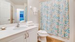 Jack & Jill bathroom #3 with bath & shower over, single vanity & WC from Providence rental Villa direct from owner
