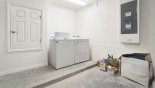 Laundry facility in garage with washer & dryer from Sable Palm 1 Villa for rent in Orlando