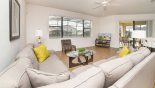 Family room with views onto pool deck - www.iwantavilla.com is your first choice of Villa rentals in Orlando direct with owner