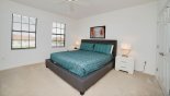 Master bedroom #1 with king sized bed and views over front gardens from Rimini 1 Villa for rent in Orlando