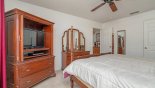 Master bedroom #1 with cabinet mounted LCD cable TV & DVD & dressing table with mirror from Highlands Reserve rental Villa direct from owner