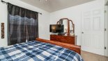 Villa rentals near Disney direct with owner, check out the Bedroom #2 with chest of drawers and LCD cable TV  & DVD above