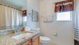 Bathroom #2 with bath & shower over, single vanity & WC - www.iwantavilla.com is the best in Orlando vacation Villa rentals